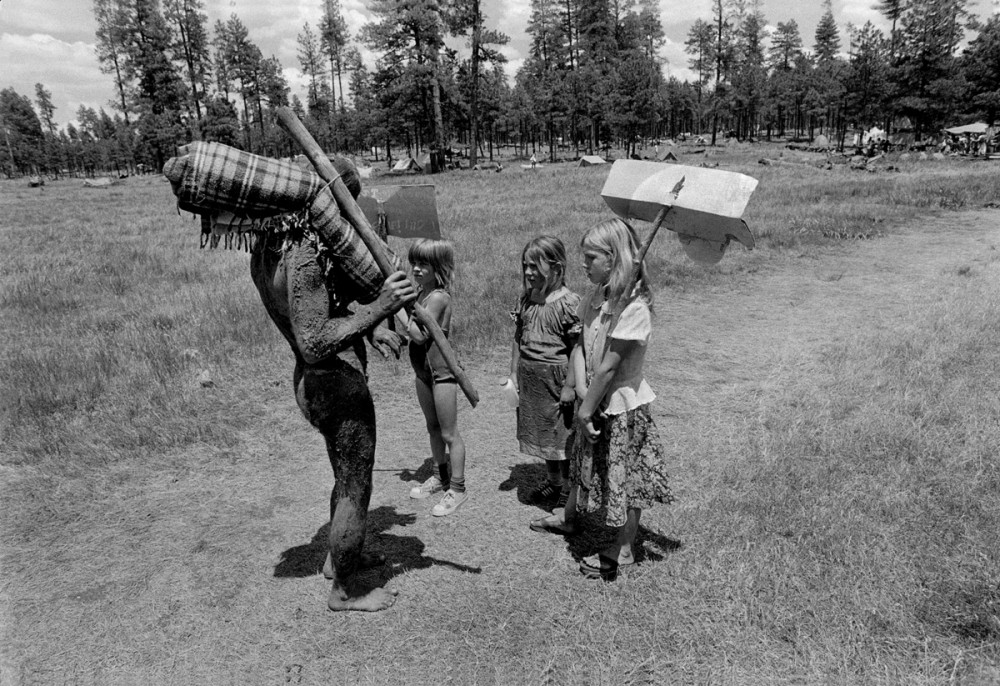 An encounter with the mud man, en route to the children's parade, The Rainbow Gathering, Alpine Arizona, July 1979
