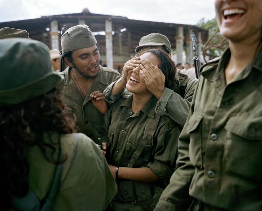 Extras from Campeche, Mexico who play rebel soldiers fighting with Che Guevara in the battle of  Santa Clara.  At the end of each day on set, extras gathered to turn in their rifles and other gear – and to relax. Photograph by Alex Harris